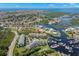 Aerial view of waterfront property with a community pool at 5537 Sea Forest Dr # 302, New Port Richey, FL 34652