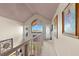 Upstairs hallway with unique decor and access to rooms at 5537 Sea Forest Dr # 302, New Port Richey, FL 34652