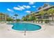 Inviting community pool with plenty of lounge chairs at 5537 Sea Forest Dr # 302, New Port Richey, FL 34652