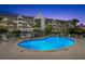 Community pool with surrounding lounge area at 5537 Sea Forest Dr # 302, New Port Richey, FL 34652