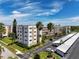 A beautiful multi-story condo building with lush landscaping and ample parking at 5603 80Th N St # 209, St Petersburg, FL 33709