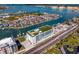 Wonderful aerial shot of the condo with canals, docks, parking, and artificial turf on rooftop at 400 150Th Ave # 304, Madeira Beach, FL 33708