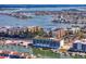 A condo with surrounding landscape, artificial turf on rooftop and waterway with boats at 400 150Th Ave # 304, Madeira Beach, FL 33708