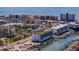 Beautiful aerial view of a condo complex near the water, surrounded by palm trees and parked boats at 400 150Th Ave # 304, Madeira Beach, FL 33708