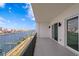This private balcony has calming water views of the docks, buildings, boats, and blue skies at 400 150Th Ave # 304, Madeira Beach, FL 33708