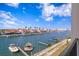 This private balcony has calming water views of the docks, buildings, boats, and blue skies at 400 150Th Ave # 304, Madeira Beach, FL 33708