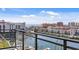 Balcony view overlooking the harbor with boats docked and townhouses in the distance at 400 150Th Ave # 304, Madeira Beach, FL 33708