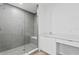 Modern bathroom featuring a glass-enclosed shower with bench and sleek vanity at 400 150Th Ave # 304, Madeira Beach, FL 33708