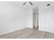 Bedroom with light wood flooring and closet at 400 150Th Ave # 304, Madeira Beach, FL 33708