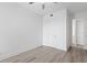 Bedroom with light wood flooring and a ceiling fan at 400 150Th Ave # 304, Madeira Beach, FL 33708