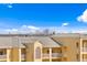 View of the apartment complex exterior that shows the roof and multiple floors that includes a great view at 400 150Th Ave # 304, Madeira Beach, FL 33708