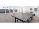 Well-lit game room featuring a ping pong table, wet bar, and harbor views at 400 150Th Ave # 304, Madeira Beach, FL 33708