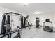 Well-equipped home gym featuring a variety of modern exercise machines and equipment at 400 150Th Ave # 304, Madeira Beach, FL 33708