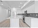 Contemporary kitchen featuring an island, stainless steel appliances, and modern lighting at 400 150Th Ave # 304, Madeira Beach, FL 33708