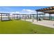 Beautiful rooftop deck with artificial turf and relaxing lounge areas at 400 150Th Ave # 304, Madeira Beach, FL 33708