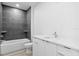 Modern bathroom with a bath and shower combination, toilet, and white vanity at 400 150Th Ave # 305, Madeira Beach, FL 33708