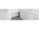 This bathroom offers double sinks and modern white cabinets and drawers at 400 150Th Ave # 305, Madeira Beach, FL 33708
