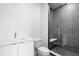 Modern bathroom featuring a glass enclosed shower, a toilet, and a white vanity at 400 150Th Ave # 305, Madeira Beach, FL 33708
