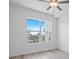 Bright bedroom with a ceiling fan, light hardwood floors, and a large window with a pleasant view at 400 150Th Ave # 305, Madeira Beach, FL 33708