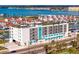 Modern condo building with a rooftop terrace, balconies, and waterfront views at 400 150Th Ave # 305, Madeira Beach, FL 33708