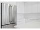 Close up on stainless steel refrigerator and white cabinetry in modern kitchen at 400 150Th Ave # 305, Madeira Beach, FL 33708