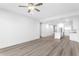 Spacious living area showcasing hardwood flooring and modern fixtures at 400 150Th Ave # 305, Madeira Beach, FL 33708