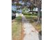 Residential street view showing sidewalk and well-maintained lawns at 15318 Harbor Dr, Madeira Beach, FL 33708