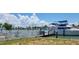 Private boat dock with a white picket fence, offering waterfront access and stunning views at 15318 Harbor Dr, Madeira Beach, FL 33708