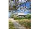 Two-story house with a modern design, surrounded by a well-maintained lawn at 15318 Harbor Dr, Madeira Beach, FL 33708