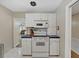 Bright kitchen with white cabinets and blue tile countertops at 4004 W Coachman Ave, Tampa, FL 33611