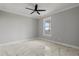 Bright bedroom with marble floors and a ceiling fan at 211 Dolphin Pt # 501, Clearwater, FL 33767