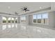 Bright living room with marble floors and large windows offering scenic views at 211 Dolphin Pt # 501, Clearwater, FL 33767