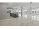 Open floor plan with marble floors and kitchen island at 211 Dolphin Pt # 501, Clearwater, FL 33767