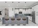Modern kitchen with white cabinets and granite countertops at 211 Dolphin Pt # 501, Clearwater, FL 33767