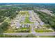 Aerial view of neighborhood with multiple houses and green landscape at 10913 Trailing Vine Dr, Tampa, FL 33610