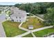 Aerial view of a spacious backyard with a white fence, green grass, and a small shed at 10913 Trailing Vine Dr, Tampa, FL 33610
