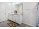 Well-lit bathroom with double vanity and ample counter space at 10913 Trailing Vine Dr, Tampa, FL 33610