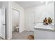 Clean bathroom featuring a double sink vanity and tile flooring at 10913 Trailing Vine Dr, Tampa, FL 33610