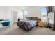 Cozy bedroom with natural light, carpet flooring, and a comfortable bed at 10913 Trailing Vine Dr, Tampa, FL 33610