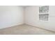 Comfortable bedroom with a view, plush carpeting, and soothing light at 10913 Trailing Vine Dr, Tampa, FL 33610