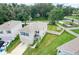 Aerial view of a two-story house with a backyard and surrounding homes at 10913 Trailing Vine Dr, Tampa, FL 33610
