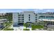 Modern building exterior with parking and waterfront views at 211 Dolphin Pt # 401, Clearwater, FL 33767