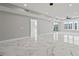 Bright and spacious living room with marble floors and large windows at 211 Dolphin Pt # 401, Clearwater, FL 33767