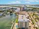 Stunning aerial view of the condominium complex showcasing waterfront access and scenic surroundings at 125 Island Way # 304, Clearwater, FL 33767