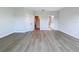 Spacious bedroom with wood-look floors and an ensuite bathroom at 7680 93Rd N St, Seminole, FL 33777