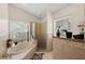 Relaxing bathroom with a soaking tub and walk-in shower at 4931 Ridgemoor Cir, Palm Harbor, FL 34685
