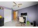 Bright bedroom with a home office setup and plenty of natural light at 4931 Ridgemoor Cir, Palm Harbor, FL 34685
