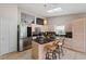 Updated kitchen with stainless steel appliances and an island with seating at 4931 Ridgemoor Cir, Palm Harbor, FL 34685