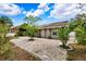 Large brick paved backyard patio with lush landscaping at 4931 Ridgemoor Cir, Palm Harbor, FL 34685