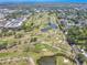 Beautiful aerial view of a golf course community with lush greenery and serene water features at 12300 Vonn Rd # 3204, Largo, FL 33774